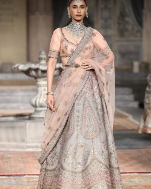 Stunning Indian model in embroidered saree on fashion runway, New Delhi.
